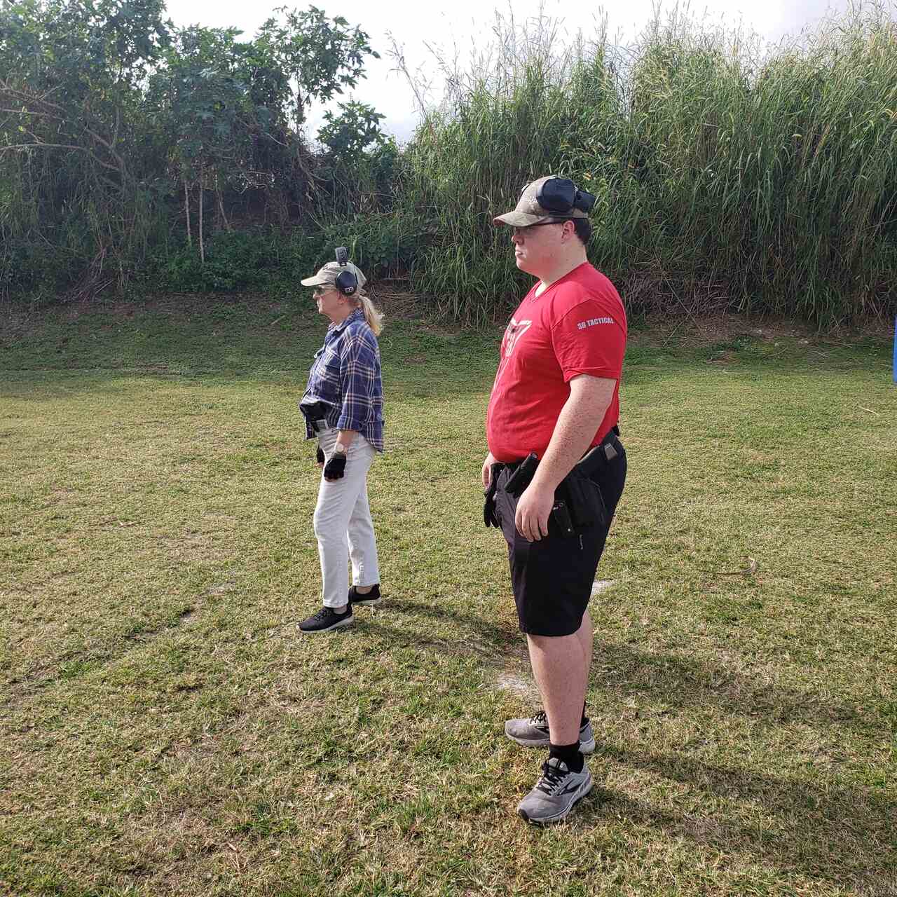 Two trainees preparing for firearms training at the outdoor range at 3B Tactical in Miami, FL