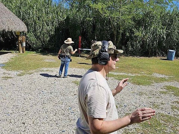 Trainees practicing shooting at targets during a training session at 3B Tactical in Miami, FL